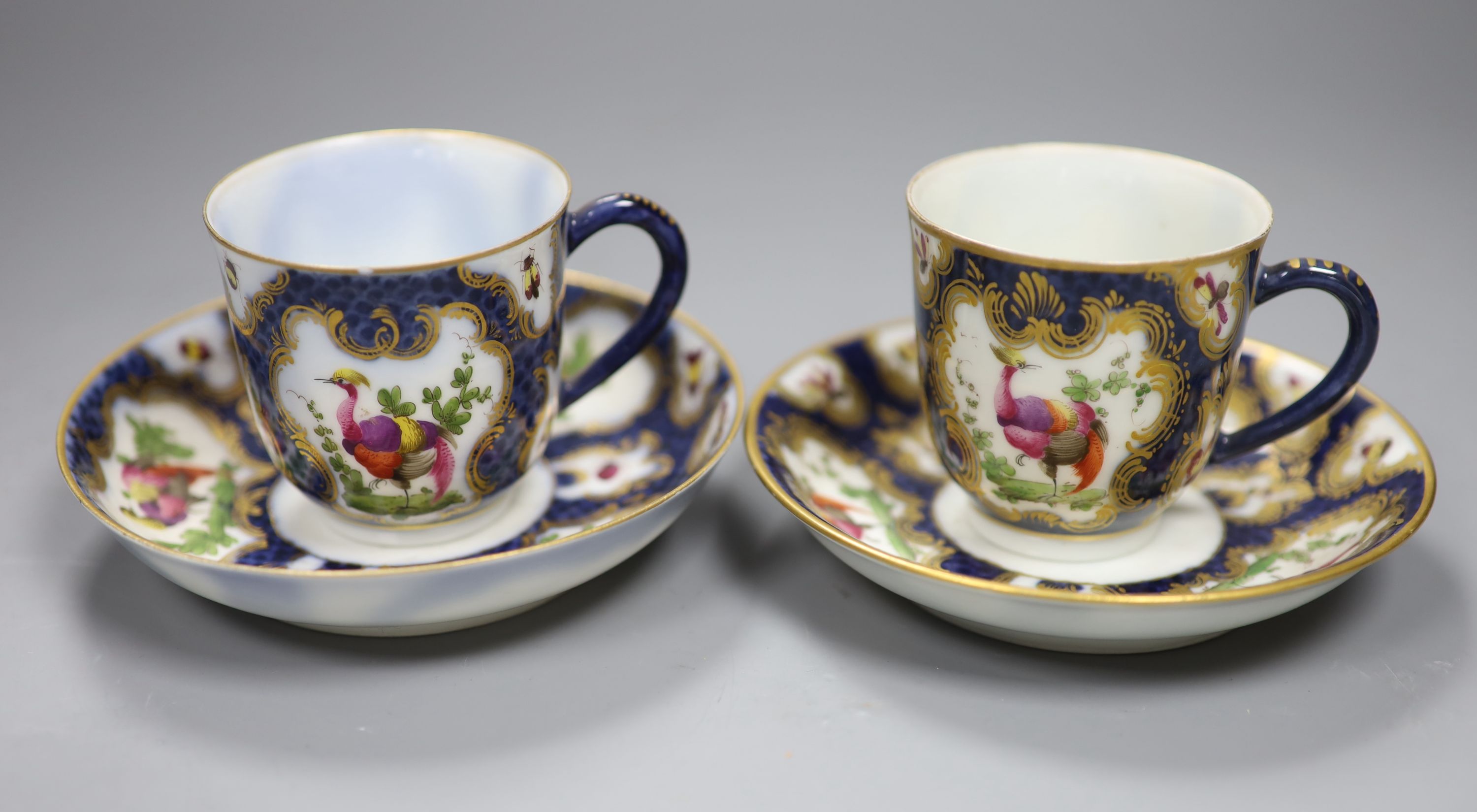 A pair of Samson copies of First Period Worcester porcelain cups and saucers, height 6cm